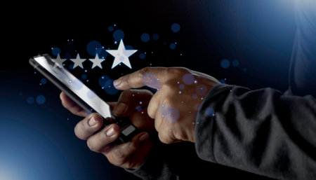 Satisfaction close up on customer man hand pressing on screen with five star rating feedback icon and press level excellent rank for giving best score point to review the service conceptの写真素材
