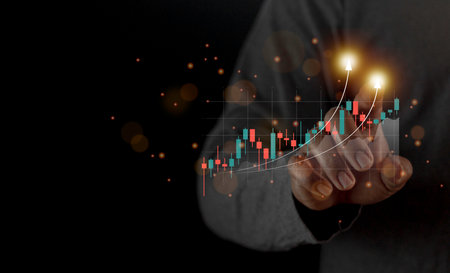 Planning and strategy stock business growth progress or success idea. Businessman or traderâs hand showing graph of browning hologram stock on virtual screenの写真素材