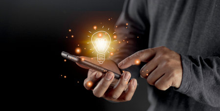 hand holding light bulb. idea concept with innovation and inspiration. Bulb light drawing idea in handの写真素材