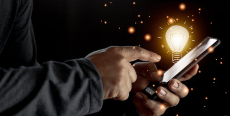 hand holding light bulb. idea concept with innovation and inspiration. Bulb light drawing idea in handの写真素材