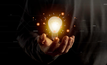 hand holding light bulb. idea concept with innovation and inspiration. Bulb light drawing idea in handの写真素材