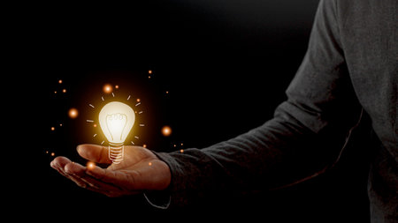hand holding light bulb. idea concept with innovation and inspiration. Bulb light drawing idea in handの写真素材