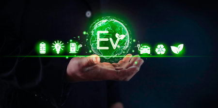 Man uses on a virtual screen of the future touching the icon: battery co2 leaf. Renewable rechargeable sources energy battery co2 reduction. Carbon dioxide ecology batteries concept.の写真素材