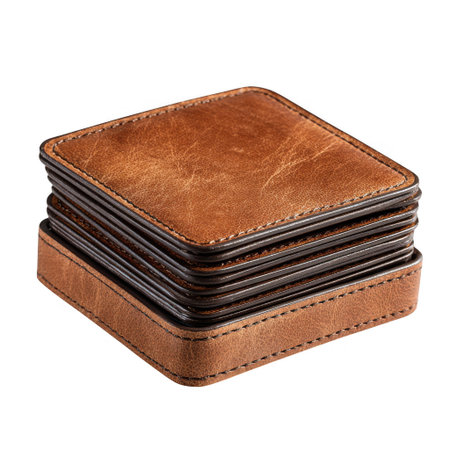 A set of square, vintage brown leather coasters stacked neatly within their matching leather holder. The detailed stitching and distressed leather texture are clearly visible on this isolated object on a white background.の素材
