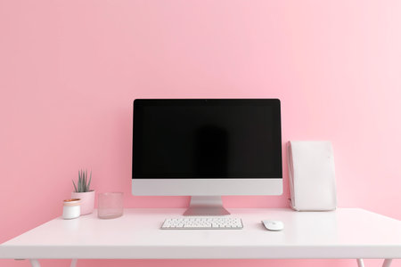 Comfortable workplace with modern computer on table near color wall. Mock upの素材