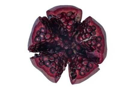 Whole pomegranate with grains on a light background.Whole pomegranate with grains on a light backgroundの写真素材