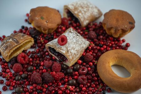 Sweets and berries on a white background.Sweets and berries on a white backgroundの写真素材