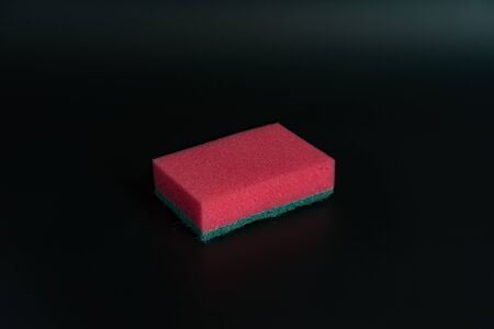 Sponge for washing dishes on the background.Sponge for washing dishes on the background