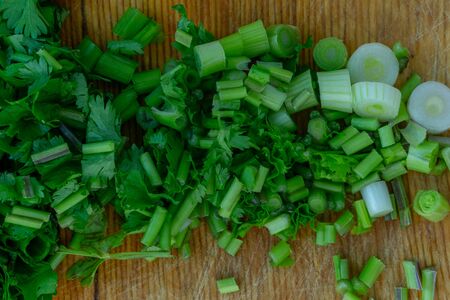 Greens cut on a cutting board.Greens cut on a cutting boardの写真素材