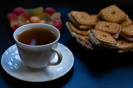 Tea with sweets. Cookies, marmalade, candies.Tea with sweets. Cookies, marmalade, candies.の写真素材