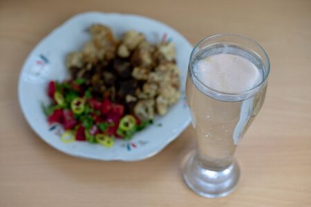 Sparkling water and delicious dinner on a plate.Sparkling water and delicious dinner on a plateの写真素材