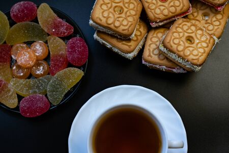 Tea with sweets. Cookies, marmalade, candies.Tea with sweets. Cookies, marmalade, candies.の写真素材
