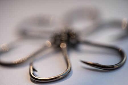 Sharp big fishing hooks on a white background.Sharp big fishing hooks on a white backgroundの写真素材