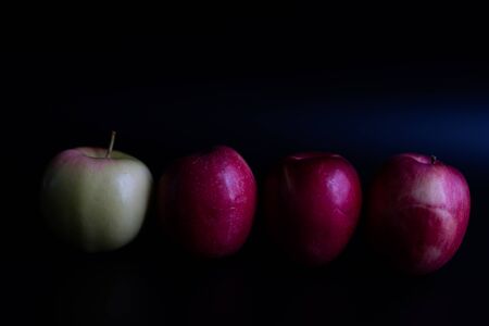 Red apples on a black background.Red apples on a black backgroundの写真素材