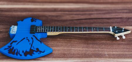 Souvenirs, electric guitar on a wooden background.Souvenirs, electric guitar on a wooden backgroundの写真素材