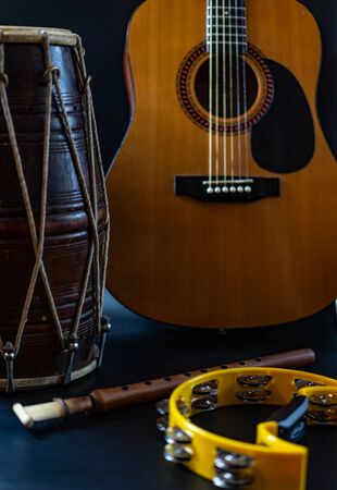 Drum duduk guitar tambourine on a black background.Drum duduk guitar tambourine on a black backgroundの写真素材