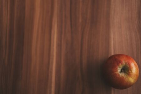 Yellow red apple on a wooden background.Yellow red apple on a wooden background