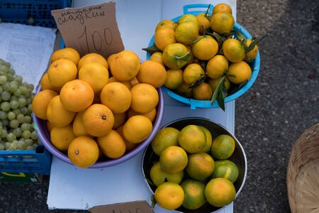 Tangerines on counter for sale.Tangerines on counter for sale.の写真素材