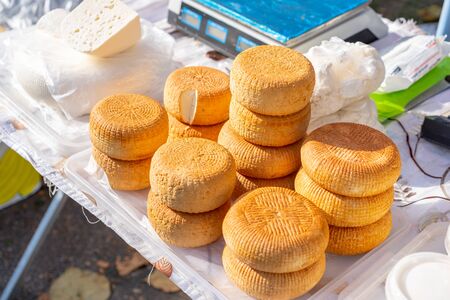 Cheeses at a fair for sale.Cheeses at a fair for saleの写真素材