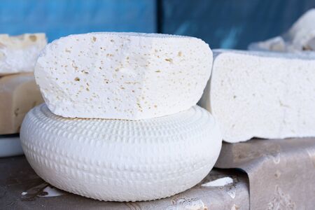 Cheeses on counter for sale.Cheeses on counter for sale.の写真素材