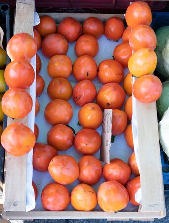 Persimmon in a box for sale.Persimmon in a box for saleの写真素材