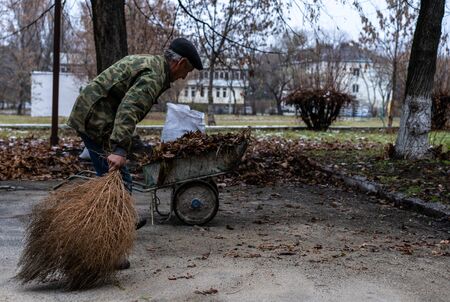 Janitor sweeping a broom yard.Janitor sweeping a broom yardの写真素材