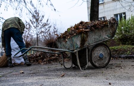 Janitor sweeping a broom yard.Janitor sweeping a broom yardの写真素材