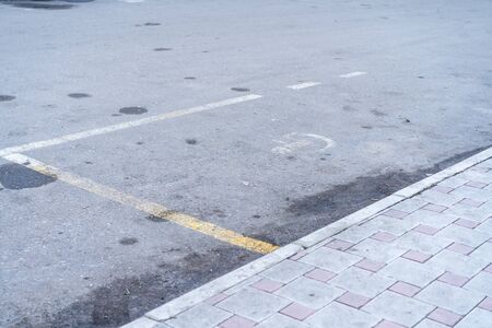 Poor condition of the parking space for the disabledの写真素材