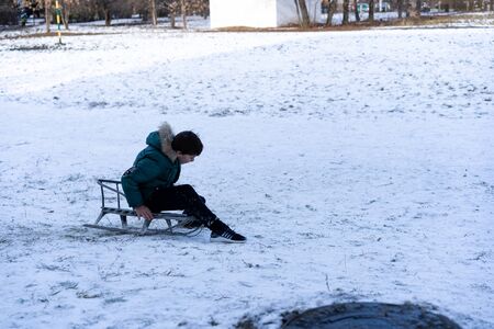 A child sledding down a hill
