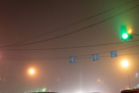 Road signs at the crossroads over the roadの写真素材