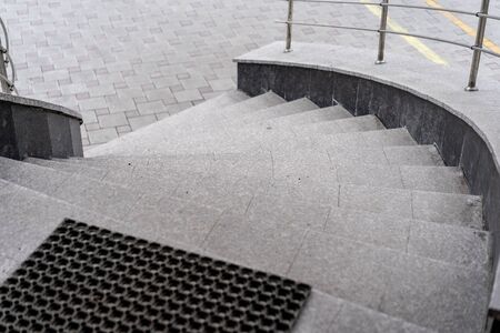 Round staircase at the exit of the buildingの写真素材