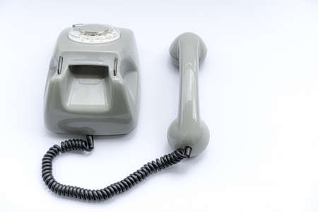 Old disk telephone on a white backgroundの写真素材