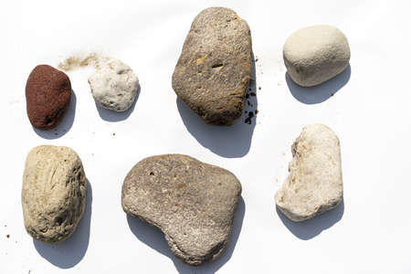 Stones lie on a white background