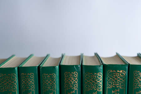 Books stand behind each otherの写真素材