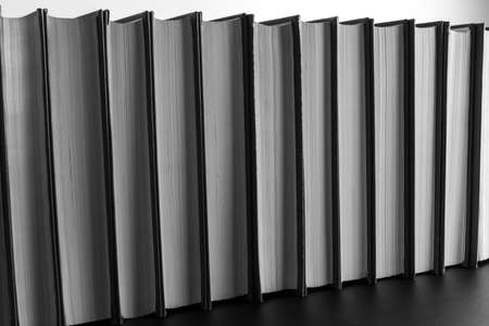 Books stand behind each otherの写真素材