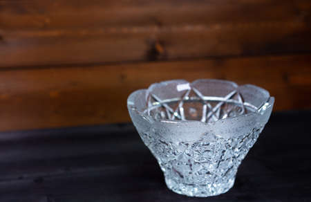 Crystal bowl on wooden backgroundの写真素材