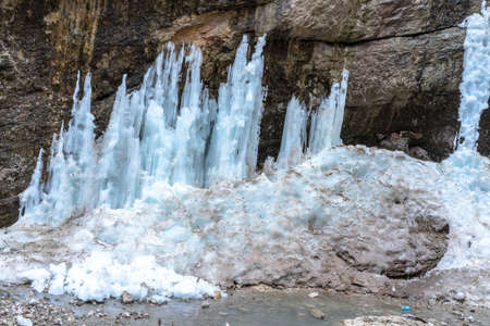 Icy waterfall by the river