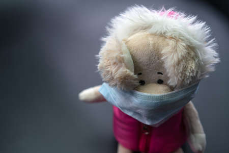 Coronavirus. Toy with mask on the face.の写真素材
