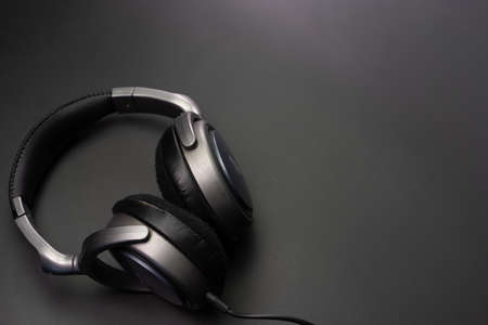 Headphones wired on a black backgroundの写真素材