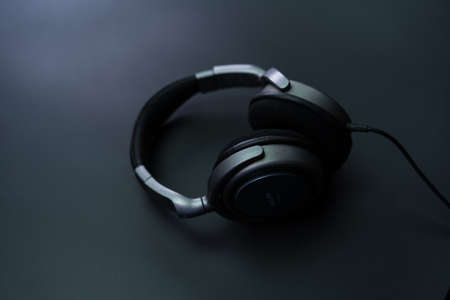 Headphones wired on a black backgroundの写真素材