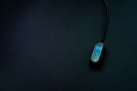 Pedometer, watch on a black backgroundの写真素材