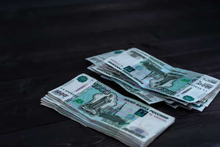 Bundle of money on wooden background