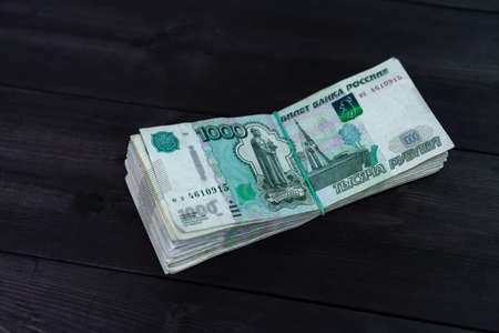 Bundle of money on wooden background