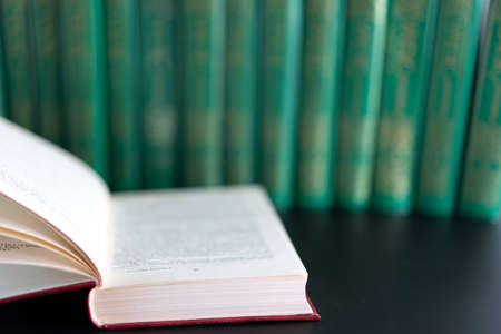 Open book on the background of other booksの写真素材