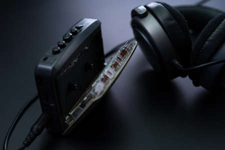 Cassette player with headphones on a black backgroundの写真素材