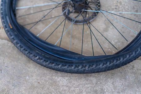 Replacing a bicycle camera on the roadの写真素材