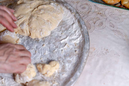 Lubricating the dough for buns before bakingの写真素材