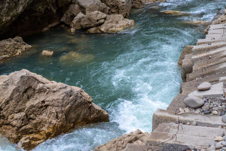 The course of a mountainous stormy riverの写真素材