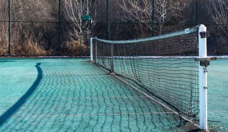 Old tennis court and tennis netの写真素材