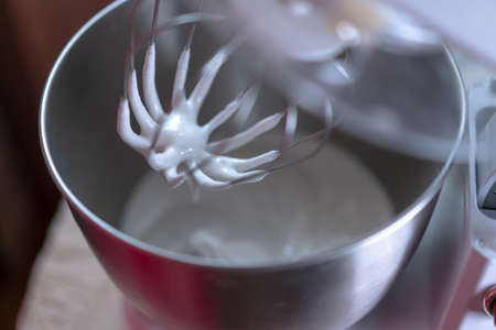 Whip the sweet cream in a mixerの写真素材